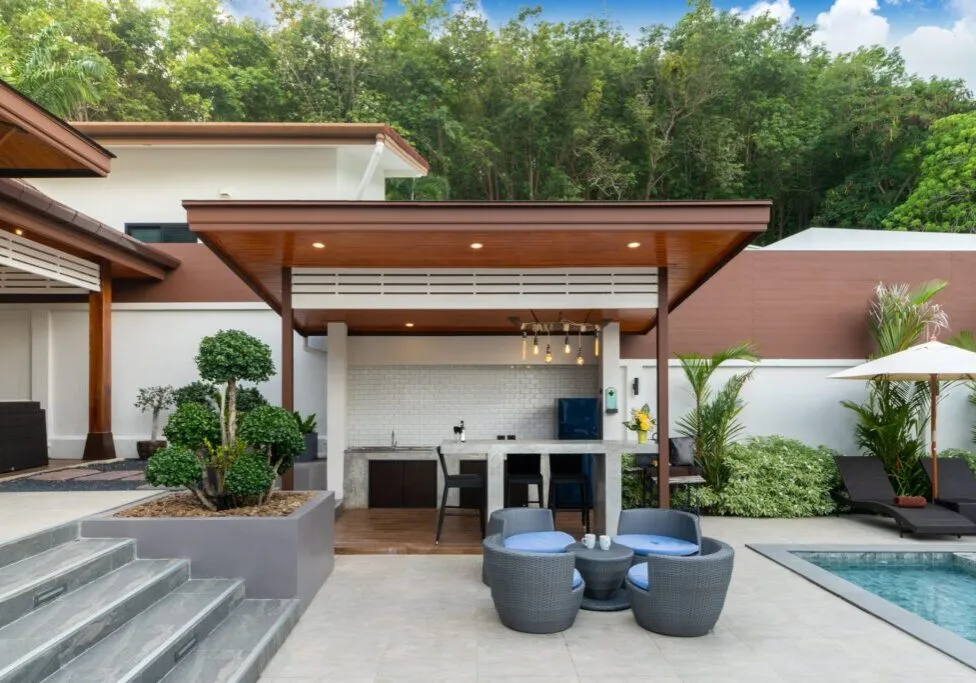 Outdoor swimming pool with counter bar in pool terrace Outdoor swimming pool with counter bar in pool terrace